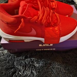 Red and White Athletic Shoes with Sleek Design